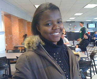 Picture of a young African American woman with a developmental disability at college.